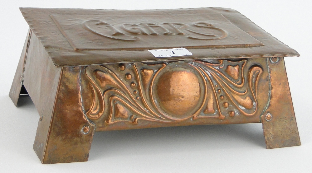 An Arts & Crafts copper cigar box with stylised panel, length 10.25".