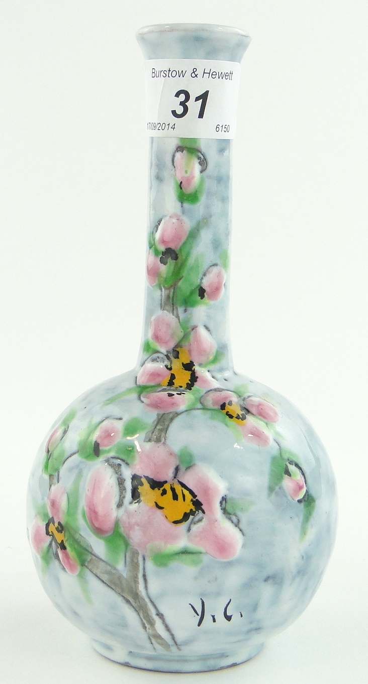 A vase with blossom decoration signed I Clement St. Paul, 7.25".