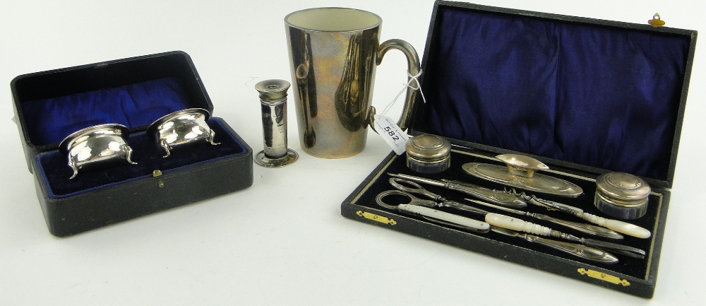 A silver overlay glass pint mug, a silver mounted manicure set in original case and a cased pair