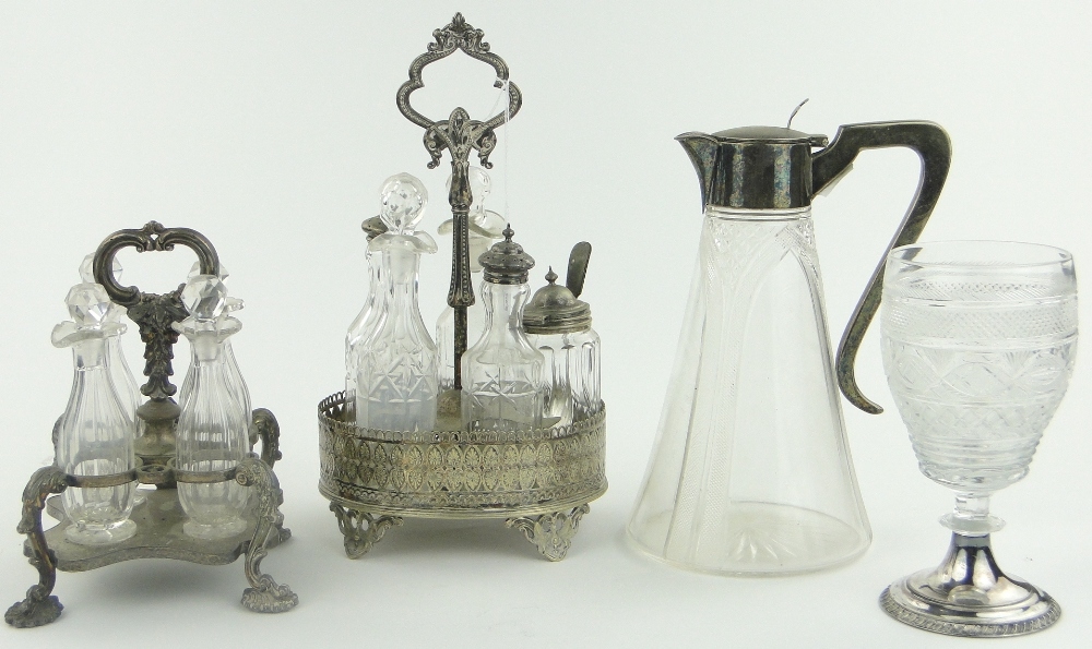 A cut-glass and silver plate claret jug, 2 cut-glass cruet sets on plated stands and a cut-glass
