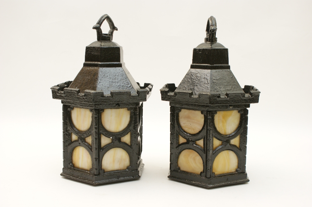 Pair of Gothic Revival cast iron porch lanterns, late 19th Century, hexagonal form with peach