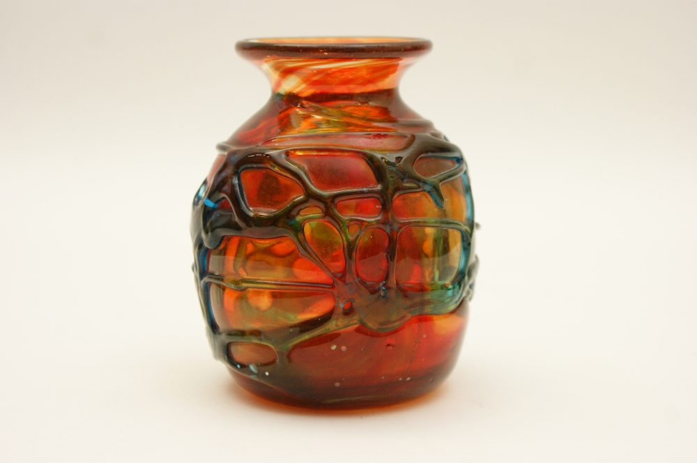 Mdina art glass vase, globular form decorated with green lattice over a red swirled ground,