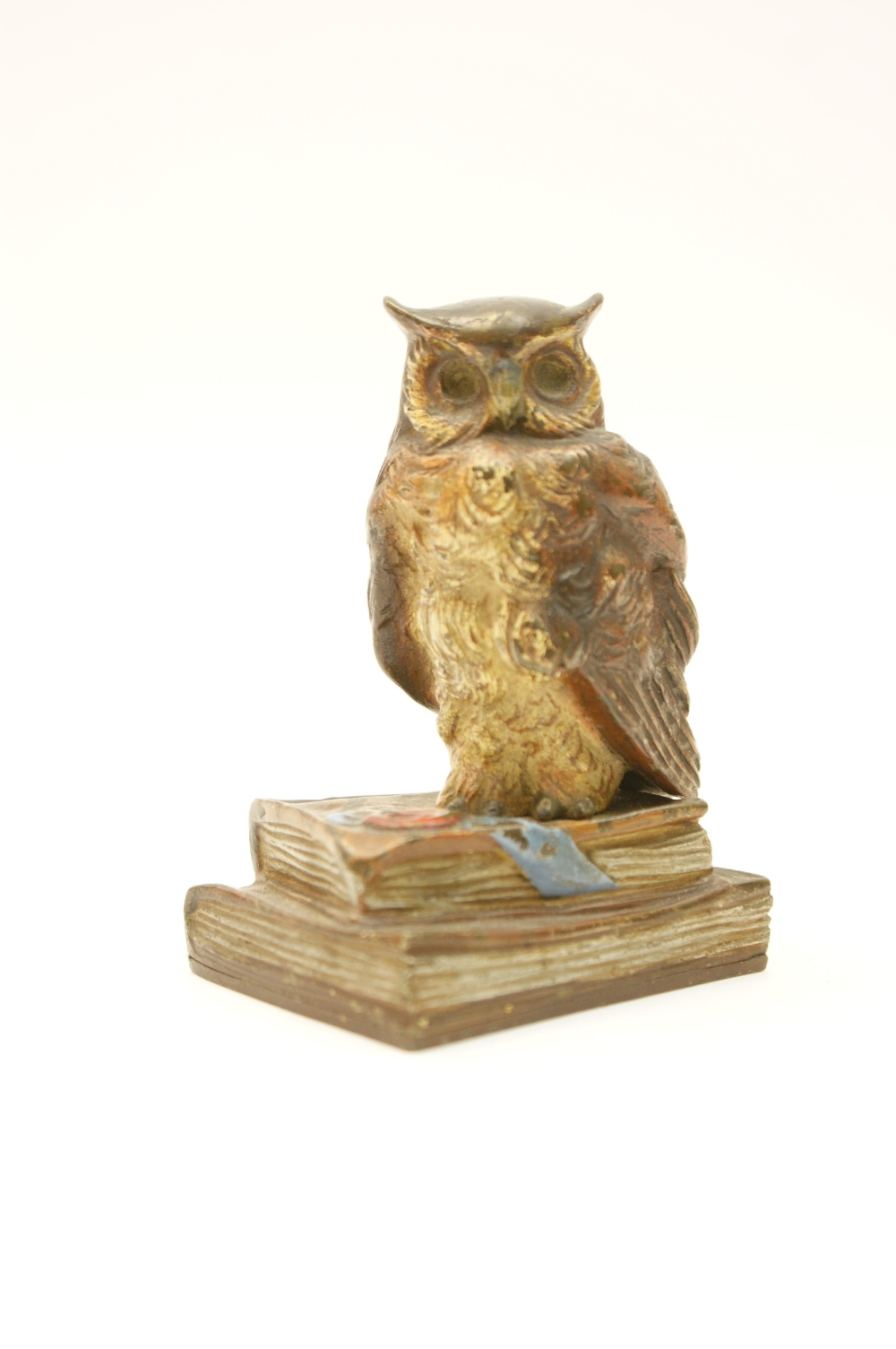 Austrian cold painted bronze paperweight in the form of an owl standing on books, signed 'Charles,