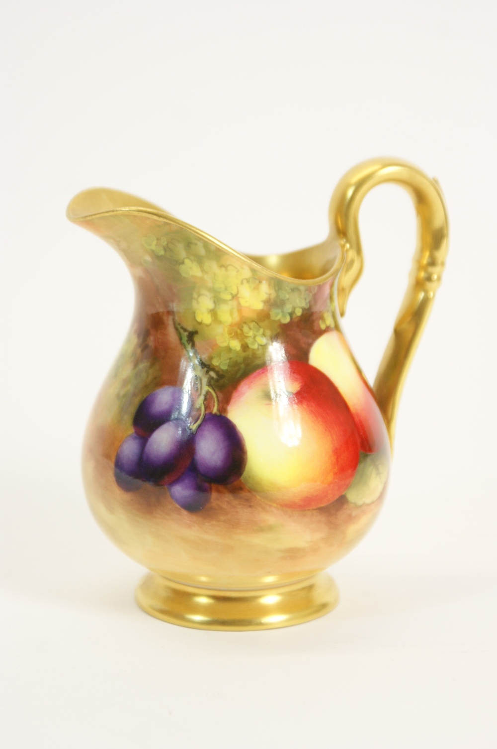 Royal Worcester fruit decorated cream jug by George Moseley, circa 1933, decorated with apples and