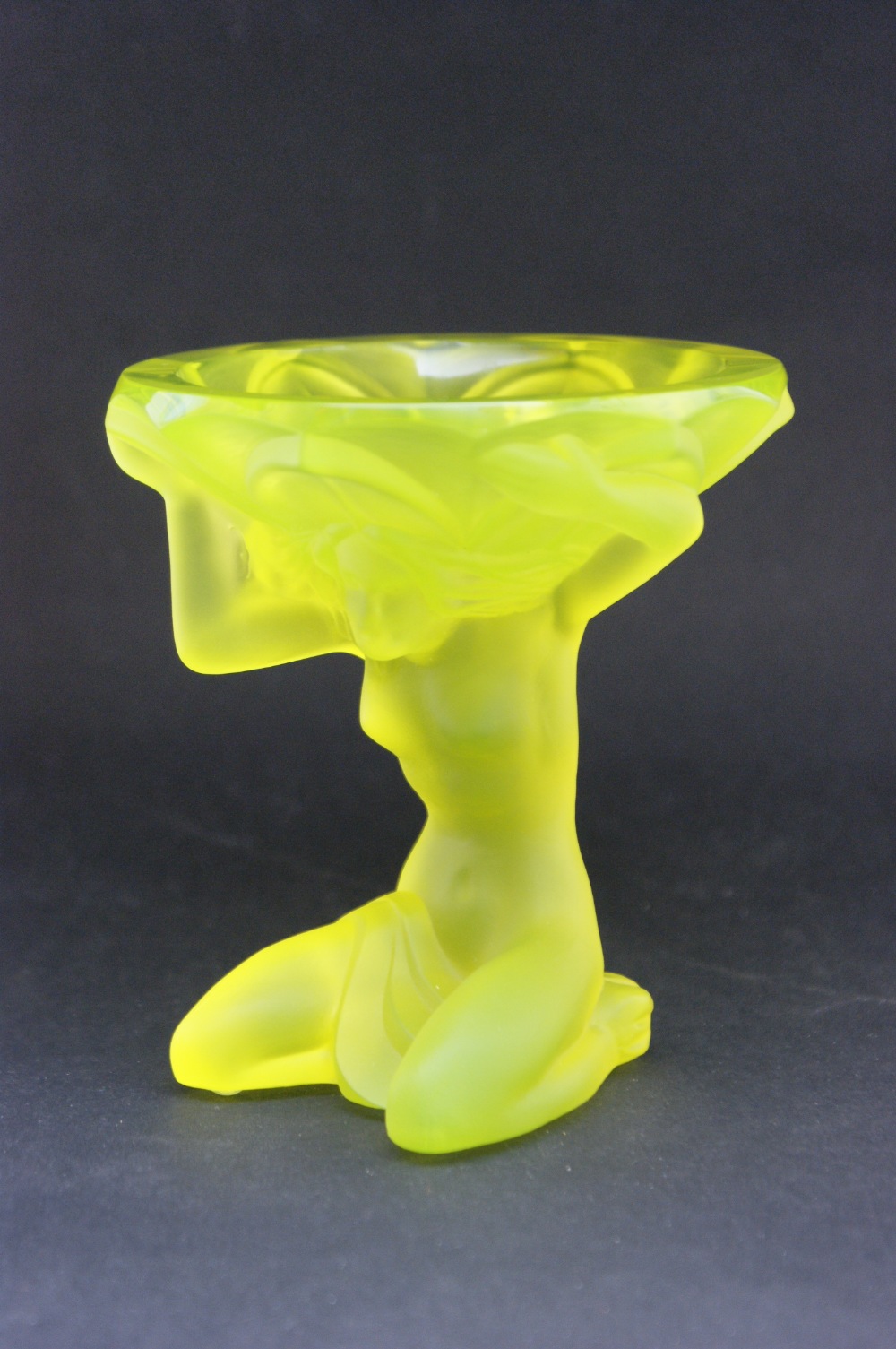 Heinrich Hoffman moulded glass pin dish, modelled as a kneeling nude, tinted with yellow, 11cm