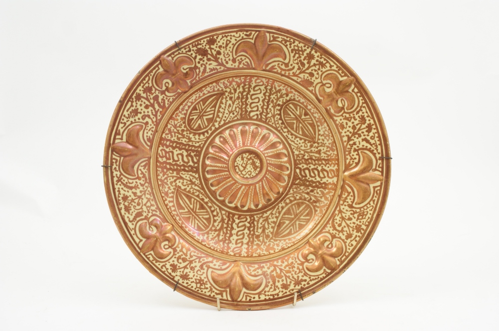 Hispano-Moresque charger, 19th Century, centred with a raised boss and bordered with fleurs-de-lys