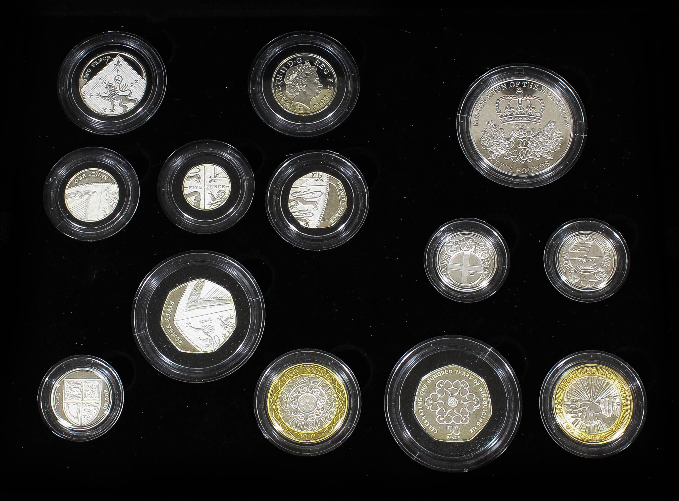An Elizabeth II 2010 silver thirteen coin set (No. 67 of edition of 3500), in Royal Mint black