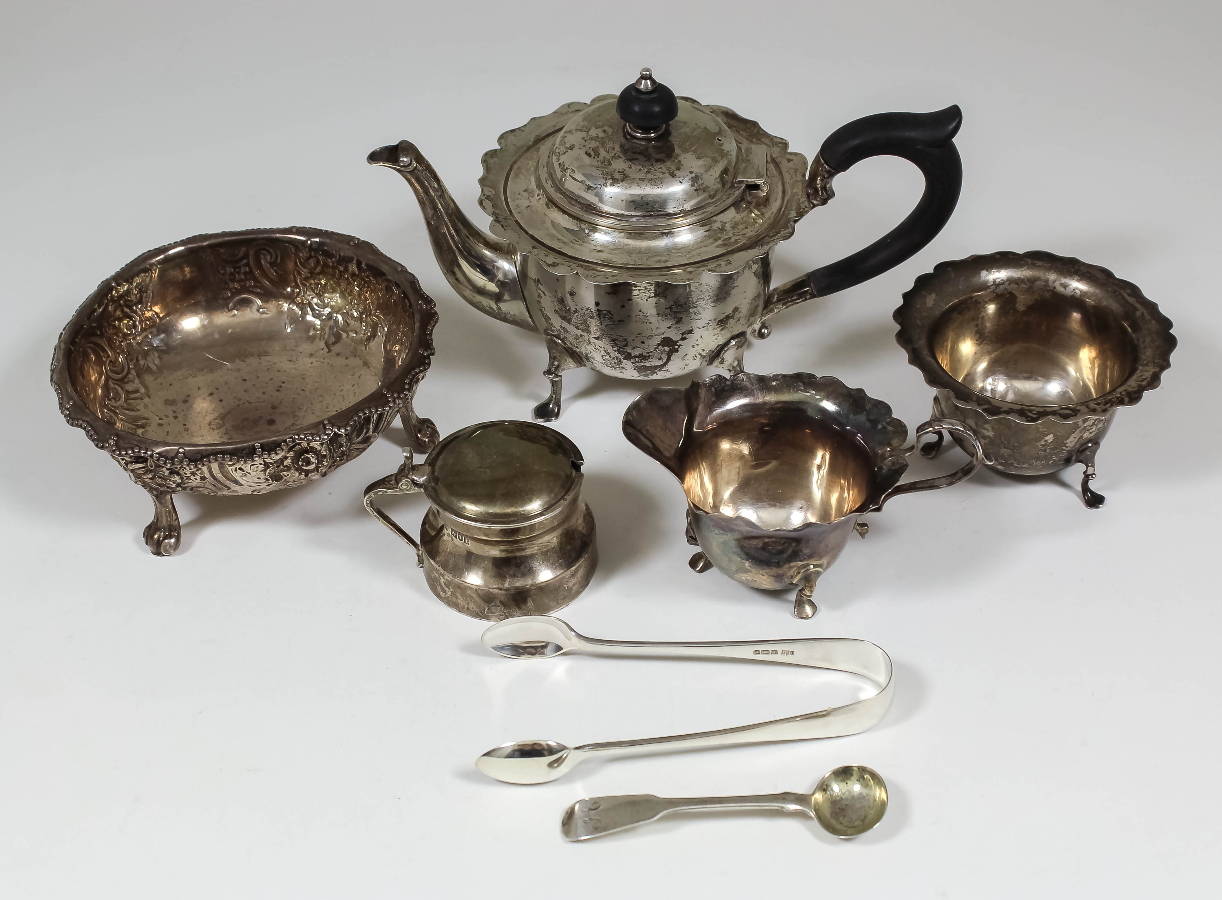 A Victorian silver circular bowl, the shaped rim with bead mounts, the body embossed with floral