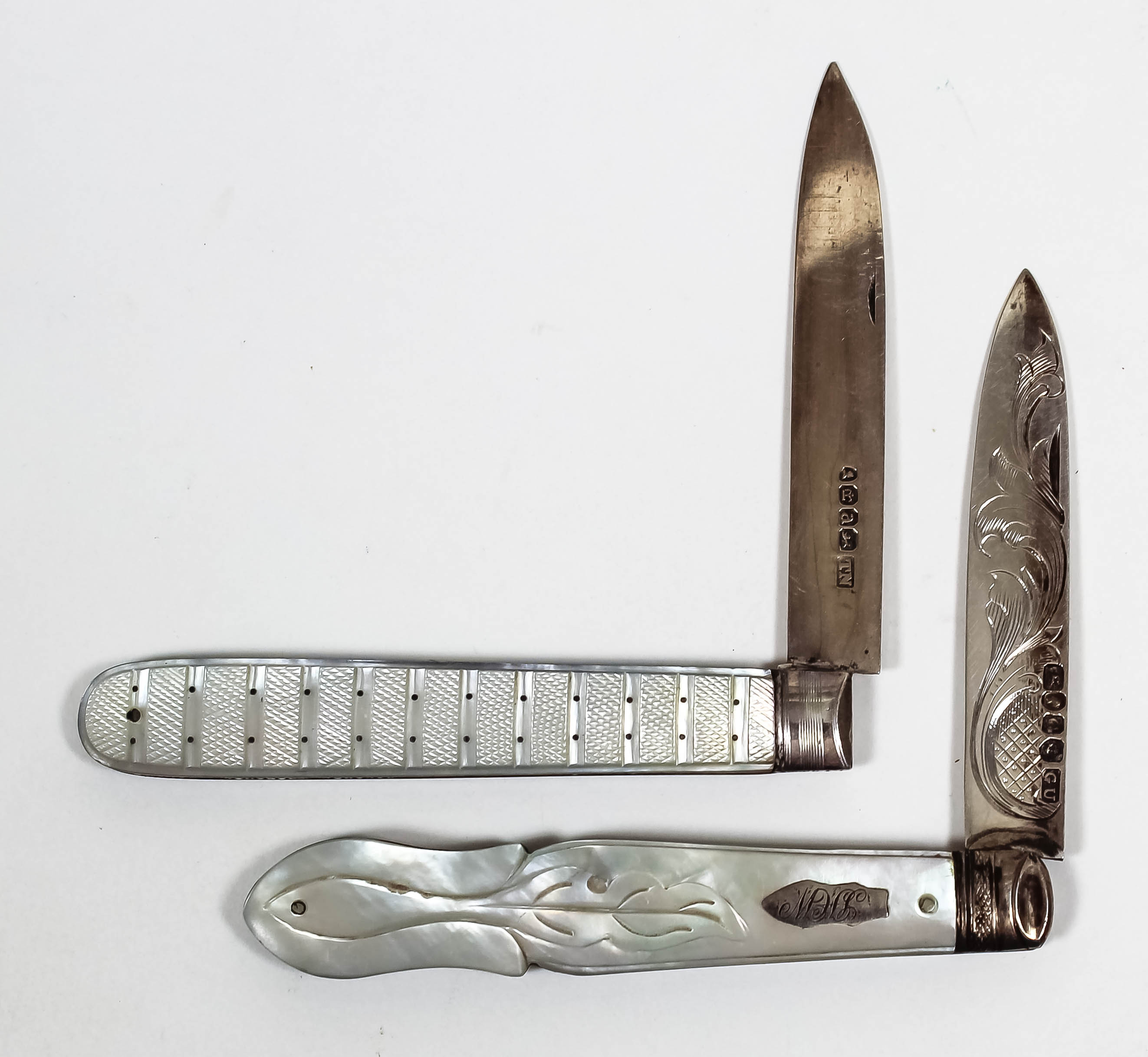 A George III silver and mother of pearl handled pocket fruit knife with cross hatch and pique