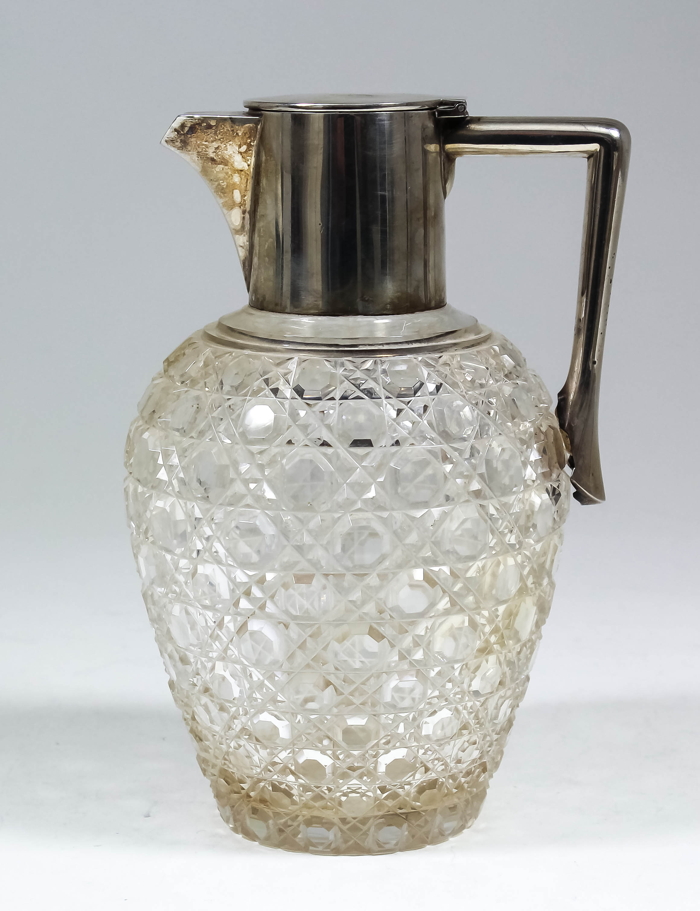 An Edward VII silver mounted and hobnail cut-glass claret jug, 7.75ins high, by The Goldsmiths &