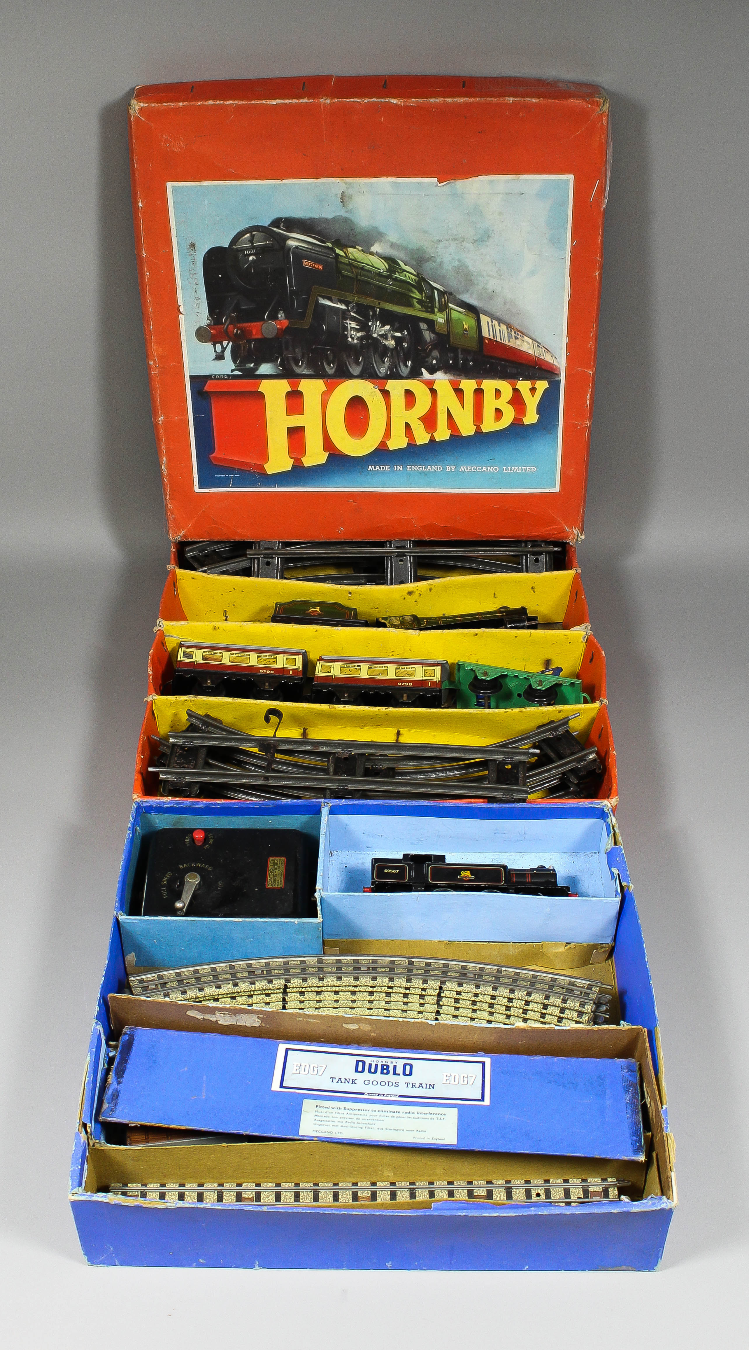 A Hornby `O` gauge clockwork tinplate passenger train set No. 21, and a Hornby `OO` electric tank