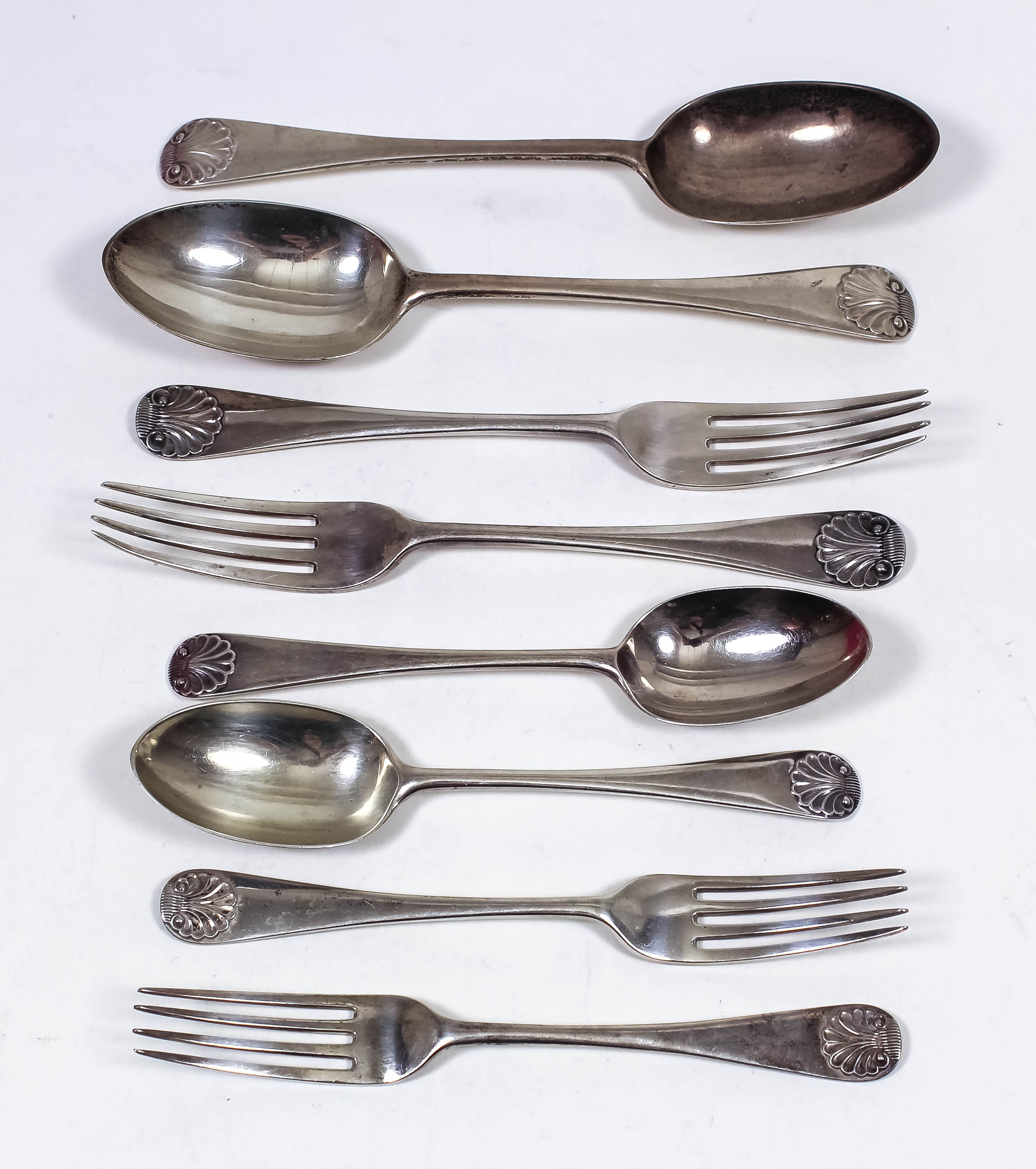 A George V silver part table service with shell pattern terminals to handles, mostly by Francis