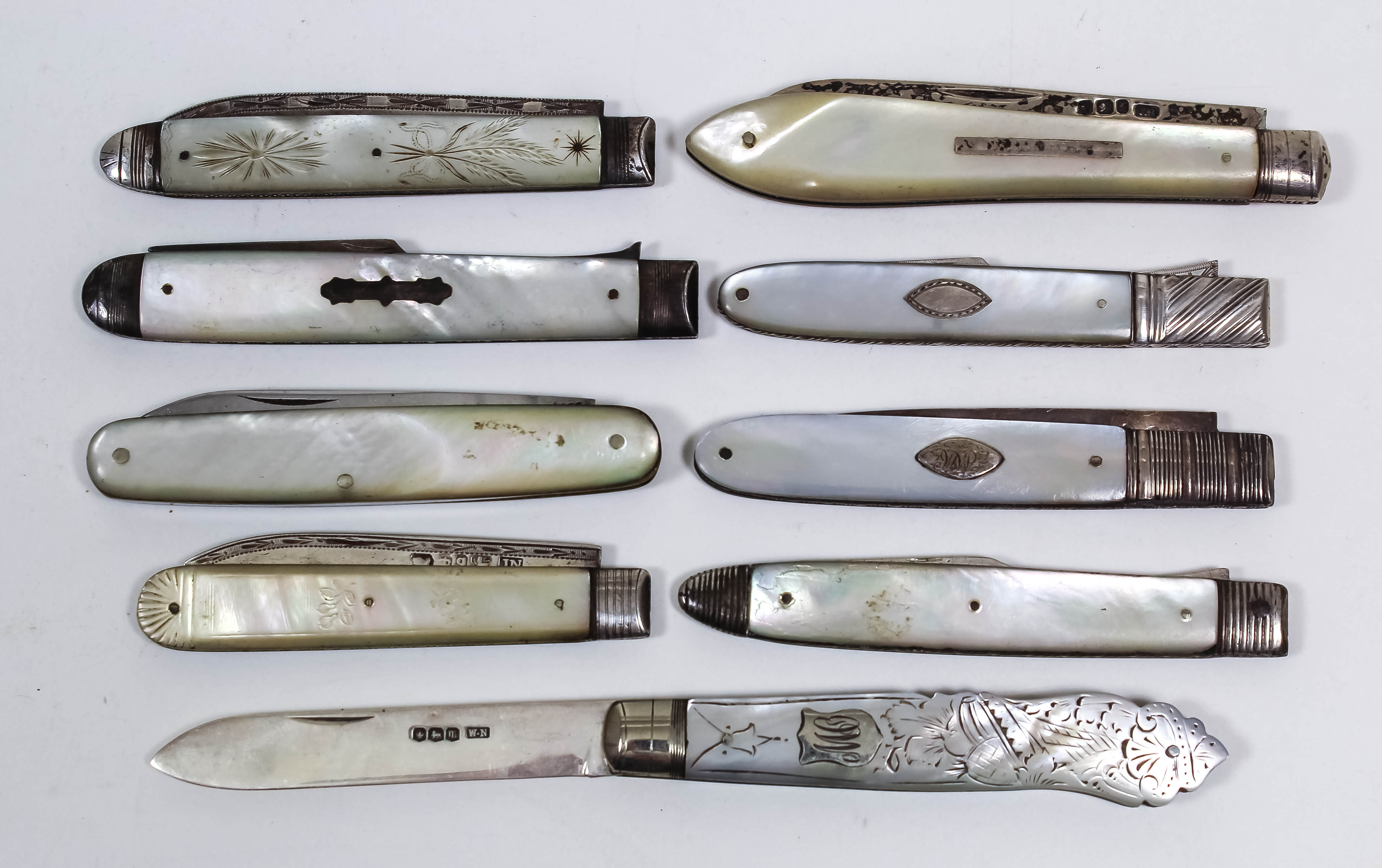 A George V silver and mother of pearl handled pocket fruit knife, the handle carved with cornucopia