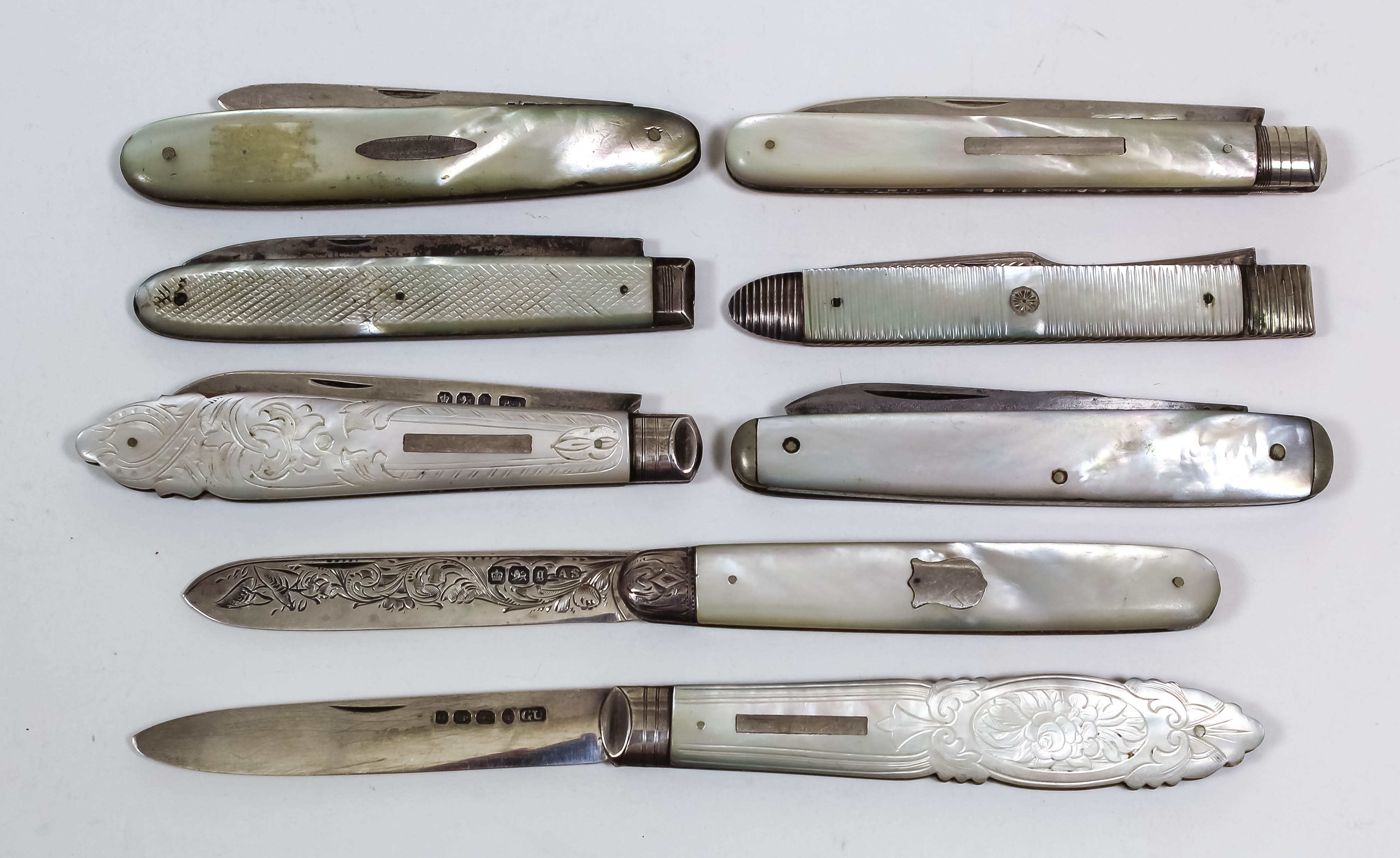 A Victorian silver and mother of pearl handled pocket fruit knife, the handle carved with oval
