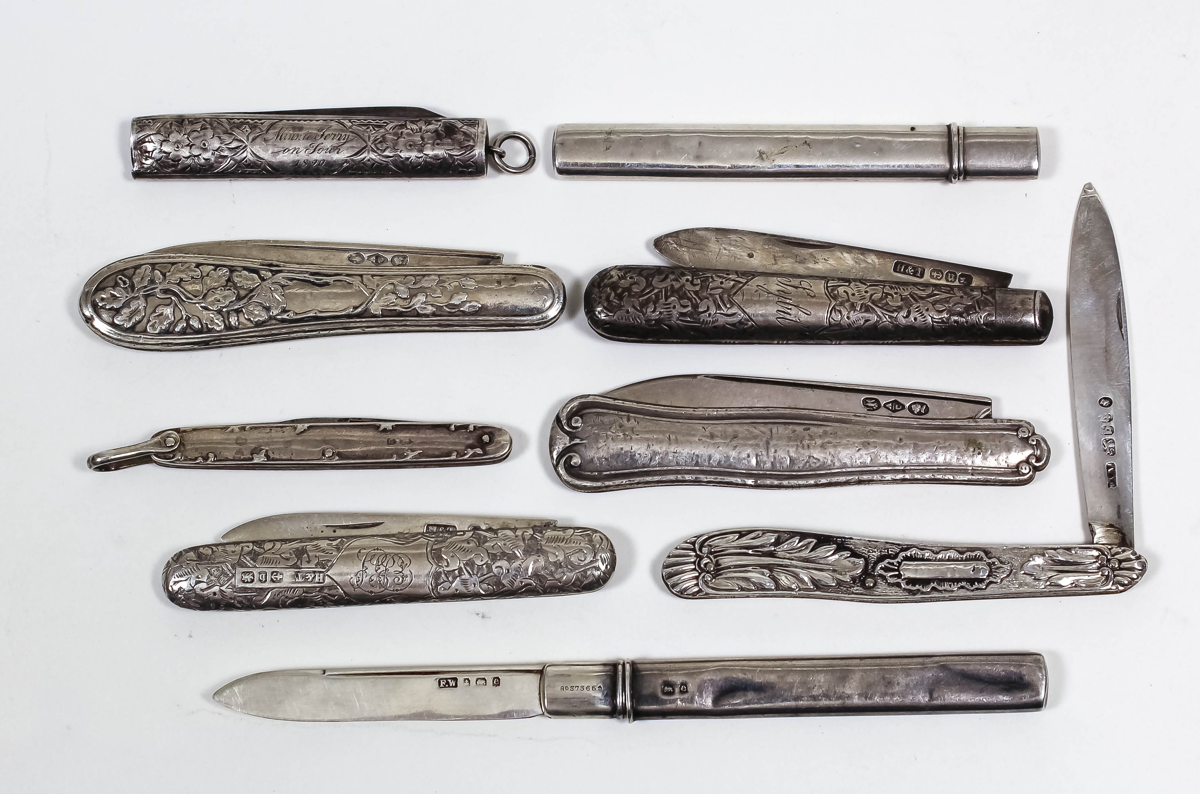 A William IV silver pocket fruit knife, the pistol grip handle cast with leaf ornament and with