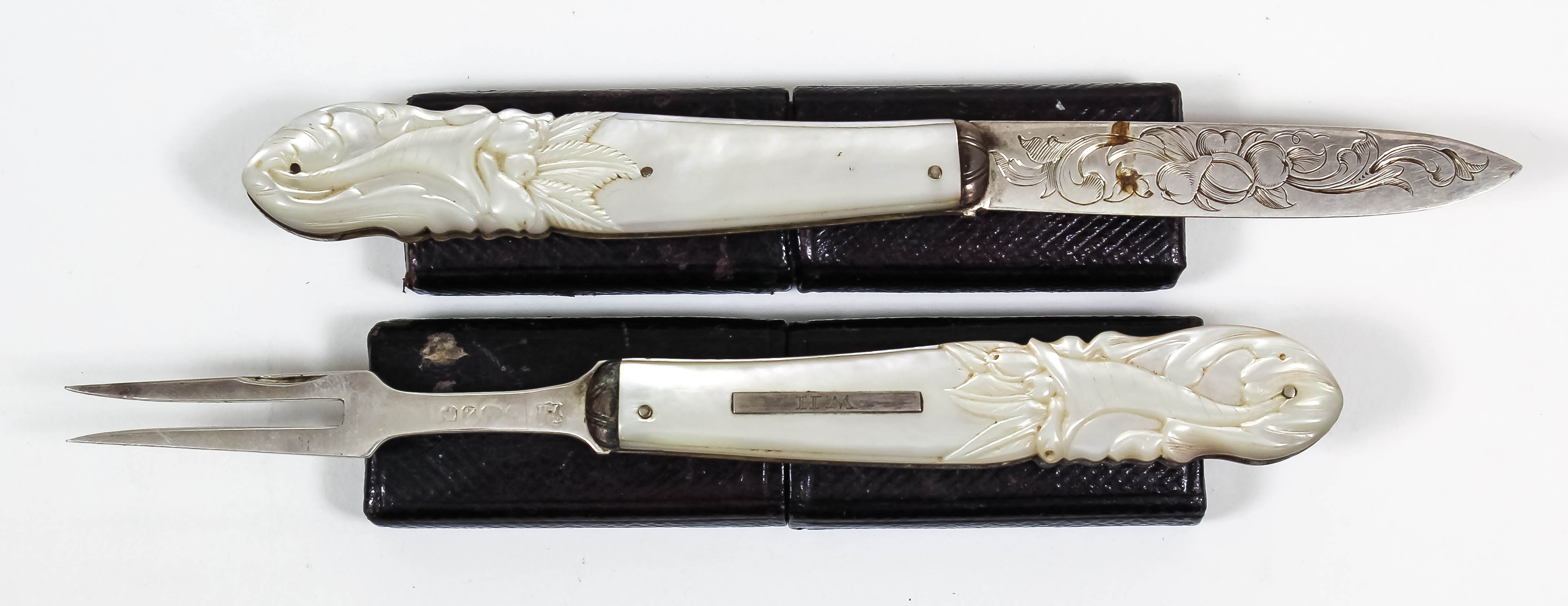 A Victorian silver bladed and mother of pearl handled pocket fruit knife and fork, the blade