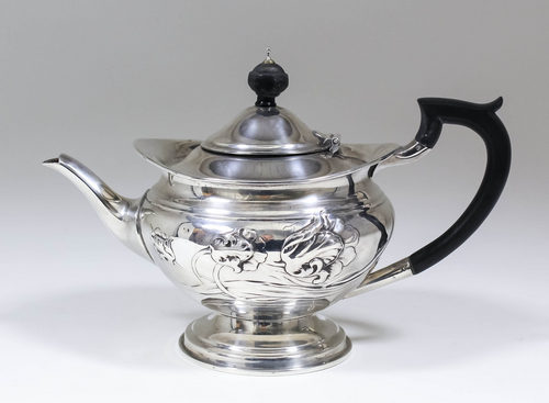 An Edward VII silver bachelor`s circular teapot embossed with flowers, with ebonised finial and