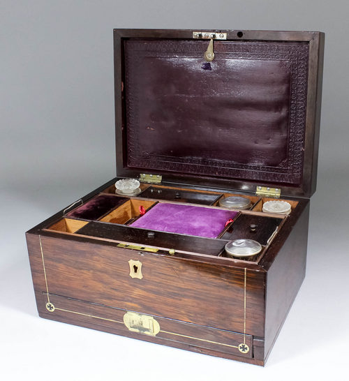 An early Victorian rosewood and brass inlaid toilet/work box inlaid with stringings and with brass