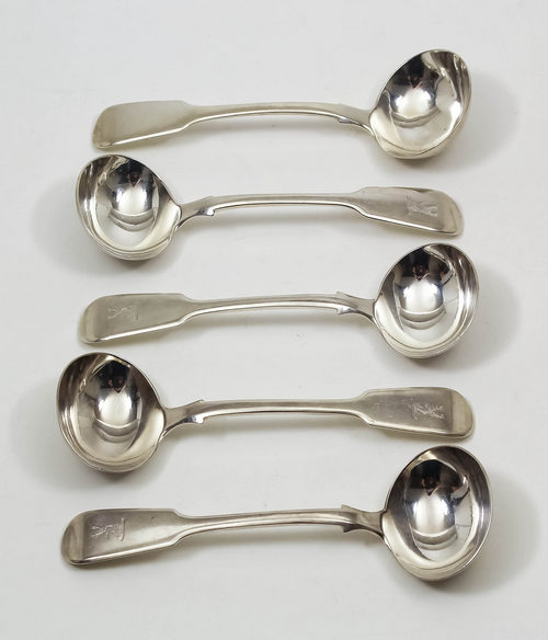 Four Victorian silver fiddle pattern sauce ladles with engraved crest to terminals, by John James