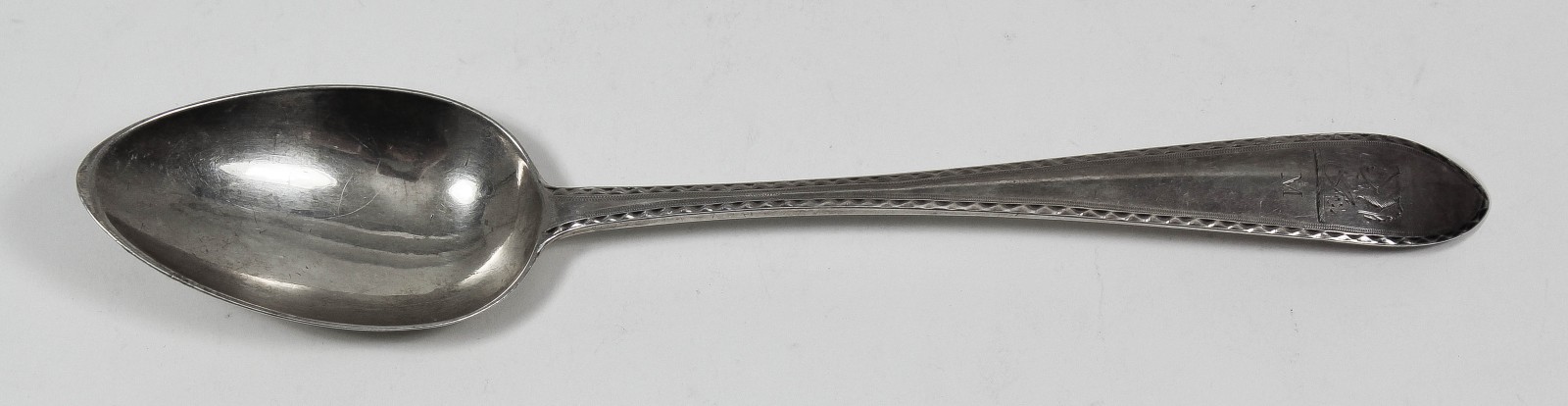 A George III Irish silver ""Celtic Point"" pattern table spoon, the terminal with bright cut