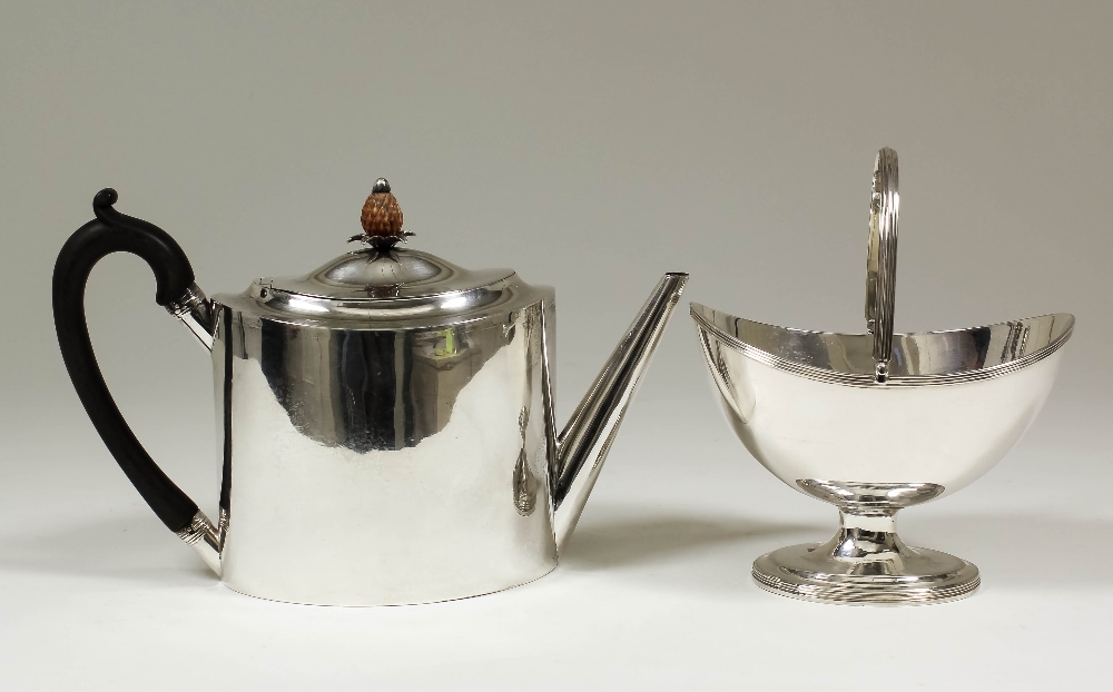 A George III silver two piece part tea service of Neo-classical design with plain oval part reeded