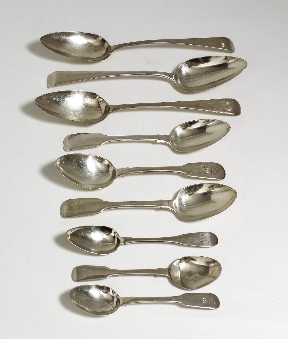 A George IV silver fiddle pattern part table service, comprising - eight dessert spoons and four tea