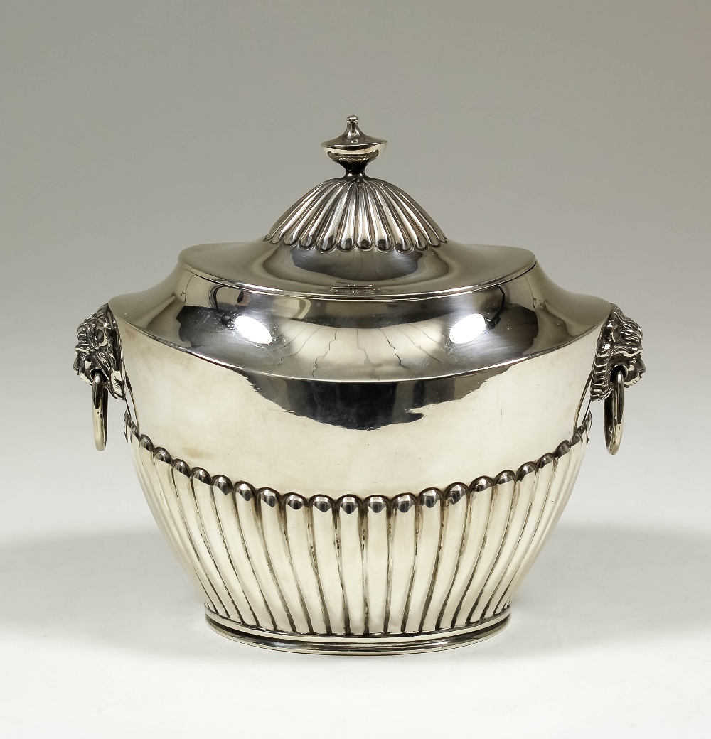 A Victorian silver two-handled lidded tea caddy with oval part reeded body, 5.5ins high, by