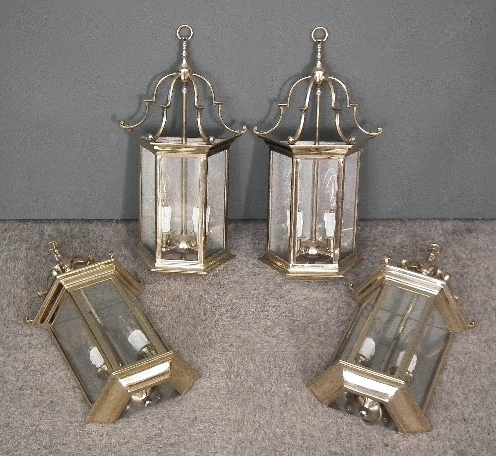 A set of four modern brass lantern style wall lights of "18th Century" design with angled fronts and