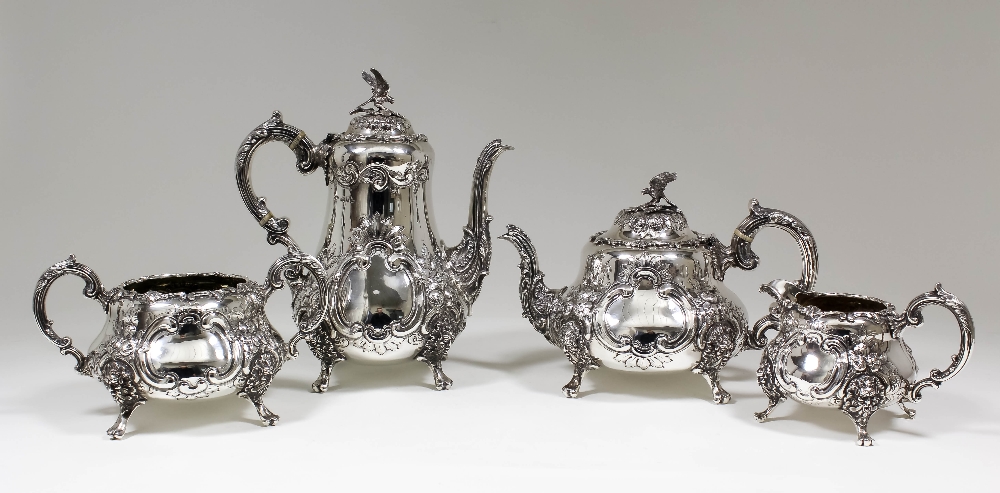 An Edward VII silver four piece tea and coffee service, the baluster shaped bodies with domed lids