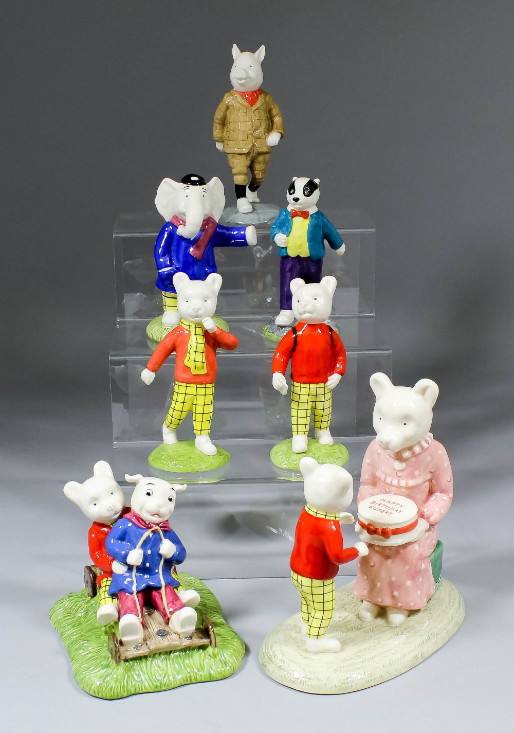 Seven modern limited edition Beswick bone china figures of Rupert and his friends, comprising - "