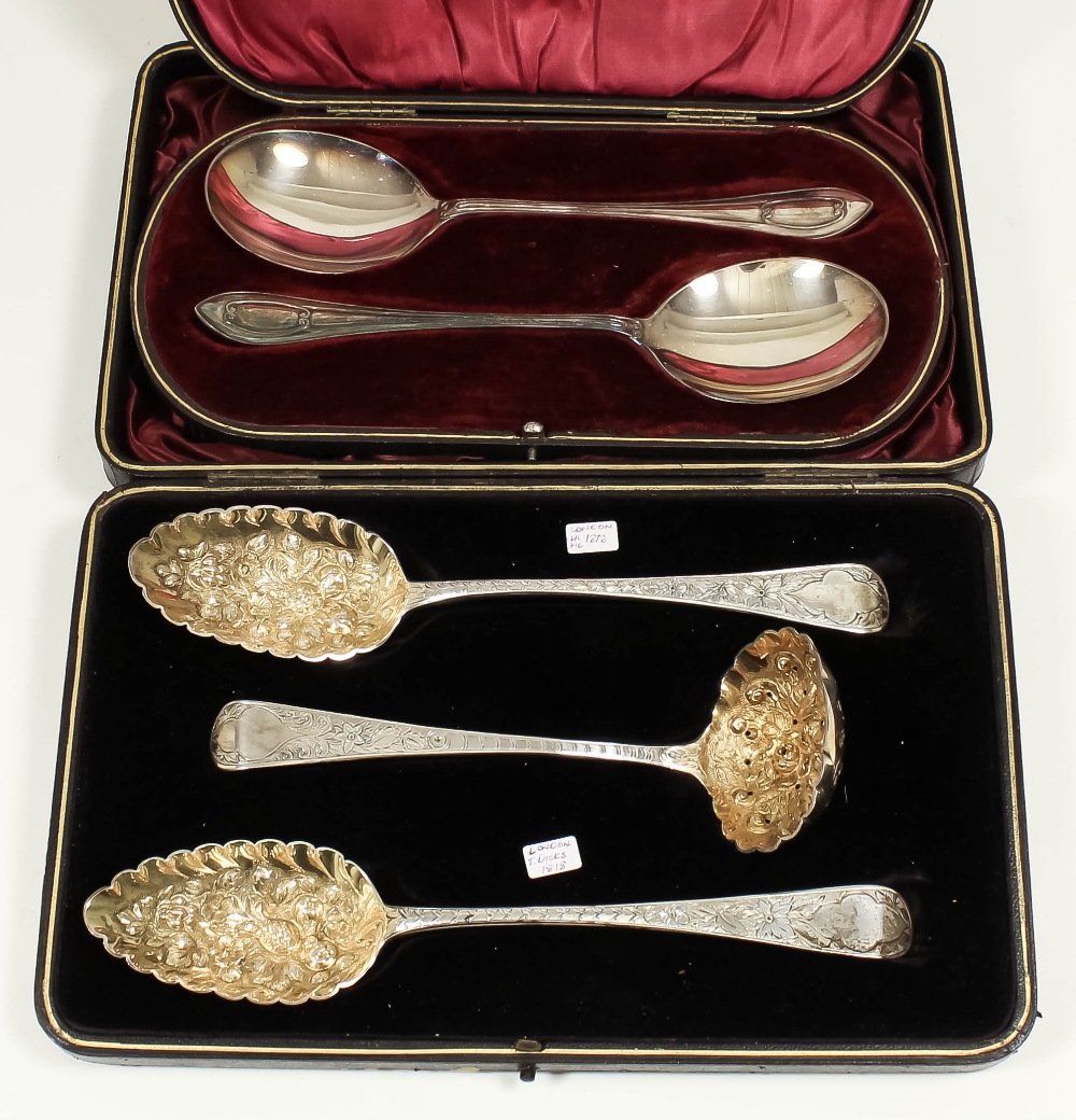 A pair of George III silver and silver gilt "Berry" spoons, the handles engraved with vacant