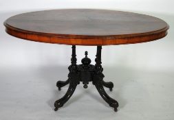 VICTORIAN FIGURED WALNUTWOOD  AND MARQUETRY INLAID TILT TOP PEDESTAL LOO TABLE, the oval, quarter