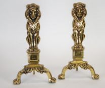 PAIR OF CAST BRASS CHENETS EACH MODELLED AS A SEATED LION, 18"" (45.7cm) high (2)