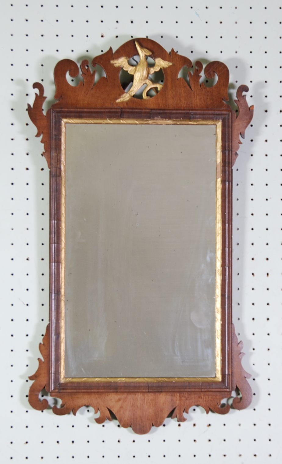 GEORGE II STYLE MAHOGANY AND PARCEL GILT WALL MIRROR, the oblong plate within a moulded frame with