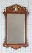 GEORGE II STYLE MAHOGANY AND PARCEL GILT WALL MIRROR, the oblong plate within a moulded frame with