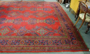 SEMI ANTIQUE TURKEY CARPET, of traditional design with rows of large green, blue  and orange floral