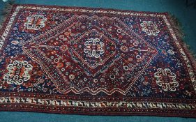 SHIRAZ PERSIAN LARGE RUG, with large and concentric centre medallion with a mainly crimson ground,