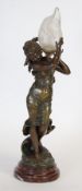 AFTER AUGUSTE MOREAU, LATE NINETEENTH CENTURY PATINATED SPELTER FIGURAL TABLE LAMP, modelled as a