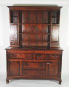 LATE GEORGIAN OAK AND MAHOGANY CROSSBANDED DRESSER, the later associated plate rack with moulded