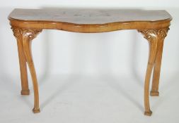 LATE NINETEENTH CENTURY FIGURED AND CARVED WALNUT CONSOLE TABLE, the serpentine fronted top with