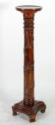 MODERN CARVED HARDWOOD JARDINIERE STAND, of tapering column form with circular moulded top, four