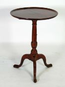 GEORGE III MAHOGANY TILT TOP TRIPOD TEA TABLE, the moulded, circular dished top above a stained