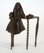 MODERN DALIESQUE PATINATED BRONZE, CAST AS A VEILED FEMALE BUST on a table, 11"" (28cm) high