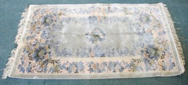 KAYAM CHINESE HAND KNOTTED SILK PILE RUG, with embossed centre floral medallion and surround to the