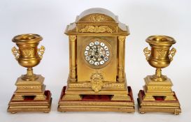 LATE 19TH CENTURY FRENCH ORMOLU GARNITURE-DE-CHEMINEE, the clock with pierced floral centre to the