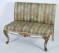 FRENCH CRACKLE CREAM AND GILT PAINTED ARMLESS TWO SEATER SETTEE, covered in green striped fabric