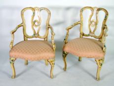 PAIR OF FRENCH CREAM AND FLORAL PAINTED OPEN ARMCHAIRS,  each with entwined splat back and outswept