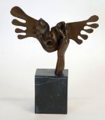 MODERN DALIESQUE PATINATED BRONZE CAST AS A HAND HOLDING A FEMALE MASK, on a black veined oblong