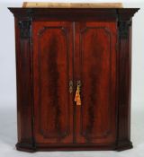 GOOD QUALITY GEORGE III FIGURED MAHOGANY CORNER CUPBOARD, the dentil moulded cornice above a pair