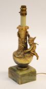 FRENCH GILT METAL TABLE LAMP, cast in high relief with a cherub kneeling on a floral encrusted